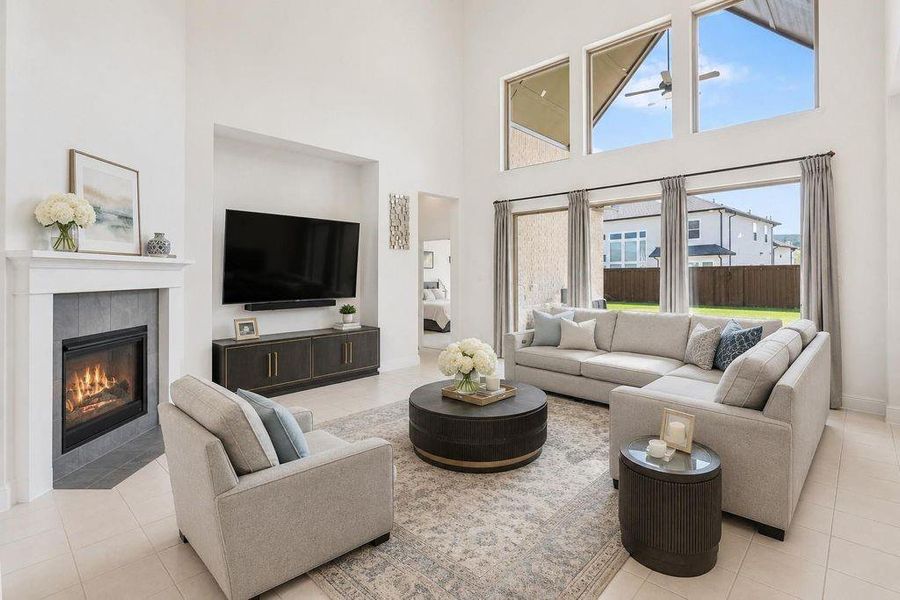 Your spacious living area featuring large windows and high ceilings, perfect for entertaining and hosting guests. -Photo has been virtually altered to help viewer with perspective