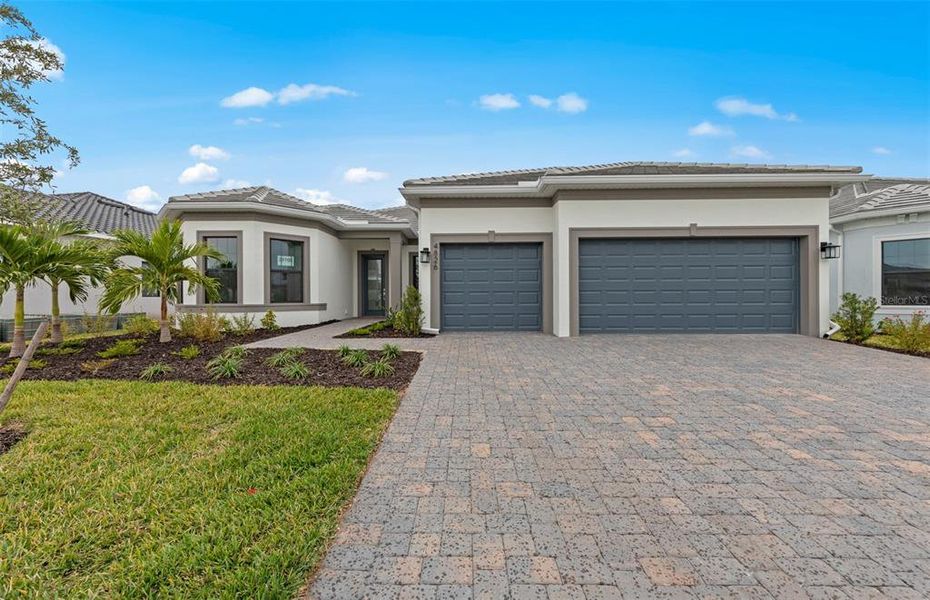 Front exterior of a new home in Del Webb Catalina, Lakewood Ranch, FL, highlighting curb appeal (Image 19).