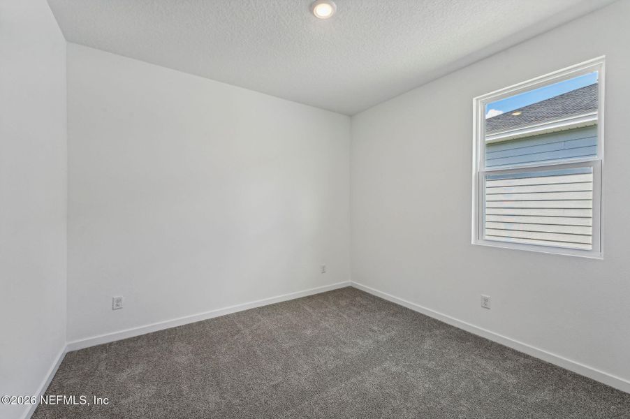 Spacious, unfurnished interior of a new home in Lakes at Bella Lago - Signature Series, Green Cove Springs (Image 32).