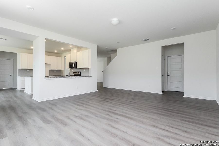 Spacious, unfurnished interior of a new home in Hidden Bluffs at TRP, San Antonio (Image 5).