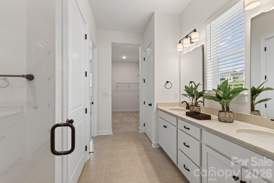 Primary Bathroom to Closet Primary Bathroom to Closet