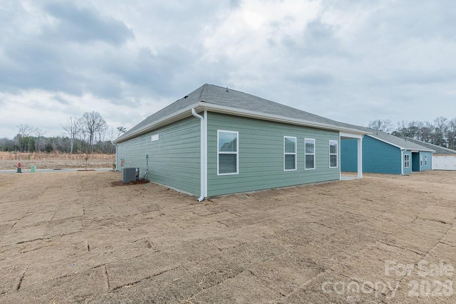 Exterior details and patio area of a home in Pine Bluff, Midland (Image 3). Exterior details and patio area of a home in Pine Bluff, Midland (Image 3).