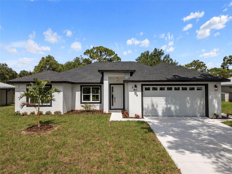 Front exterior of a new home in , Sebring, FL, highlighting curb appeal (Image 20). Front exterior of a new home in , Sebring, FL, highlighting curb appeal (Image 20).
