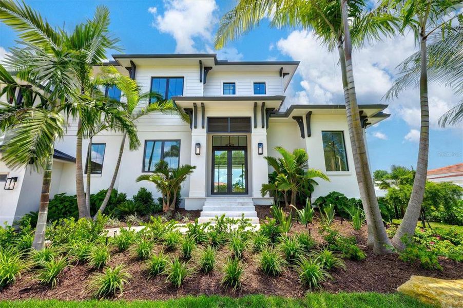 Front exterior of a new home in , Longboat Key, FL, highlighting curb appeal (Image 25). Front exterior of a new home in , Longboat Key, FL, highlighting curb appeal (Image 25).