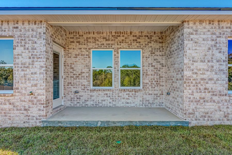 Exterior details and patio area of a home in Blossom Grove, Crestview (Image 24).