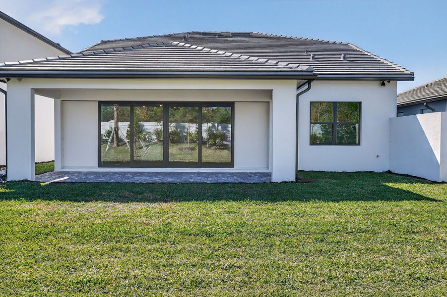 Exterior details and patio area of a home in Hendrix Reserve, Lake Worth (Image 23).