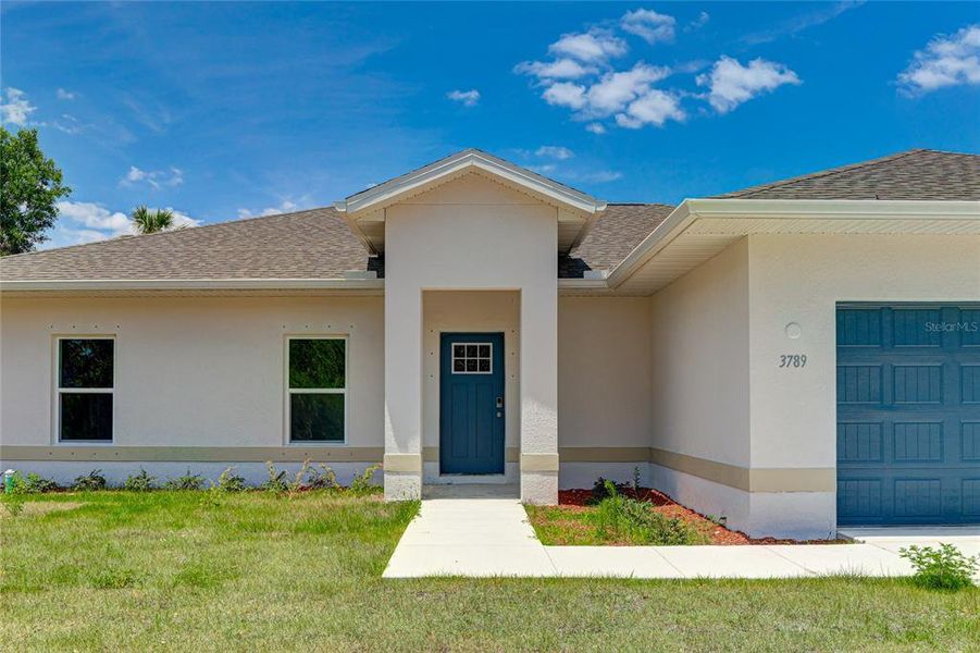 Front exterior of a new home in , North Port, FL, highlighting curb appeal (Image 28).