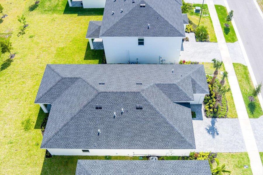 Front exterior of a new home in Seagrove: The Indies, Fort Pierce, FL, highlighting curb appeal (Image 22).
