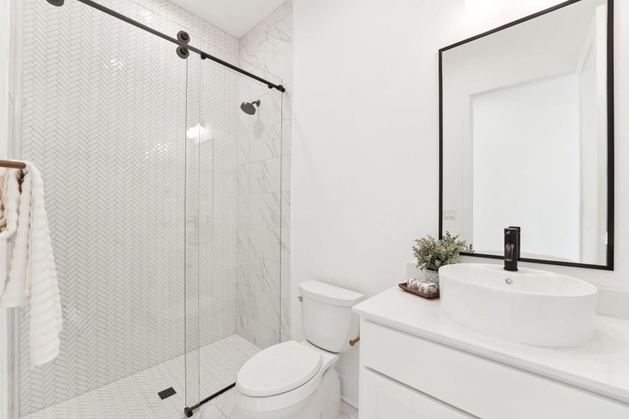 Elegant finishes and generous space define every bathroom in this home. Elegant finishes and generous space define every bathroom in this home.