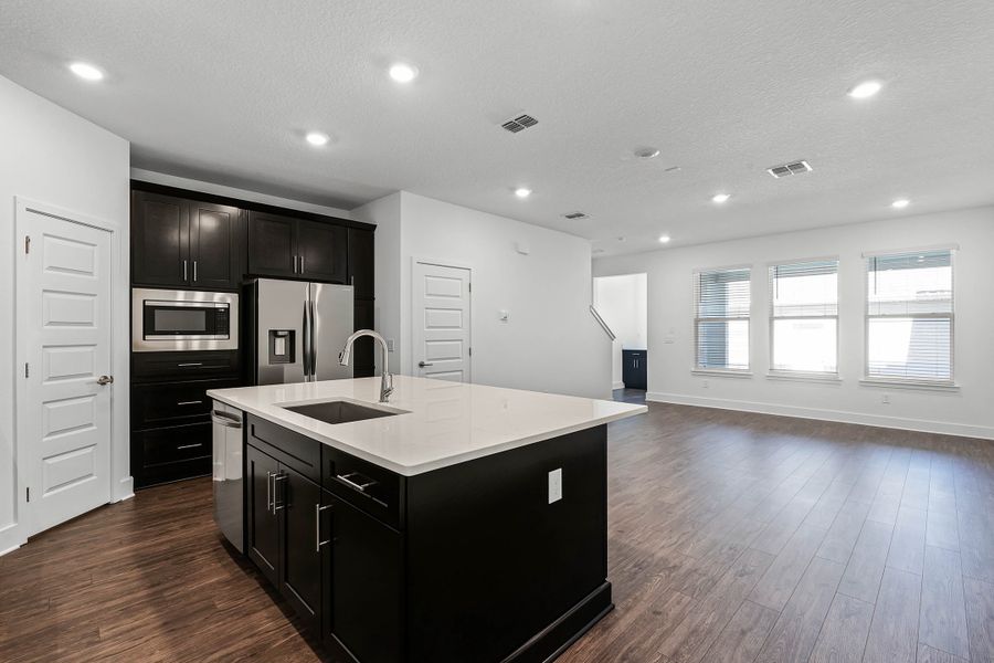 Furnished interior view inside a new home in Harvest at Ovation - Townhomes, Winter Garden (Image 8).