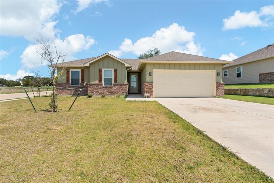 Front exterior of a new home in , Cleburne, TX, highlighting curb appeal (Image 17). Front exterior of a new home in , Cleburne, TX, highlighting curb appeal (Image 17).