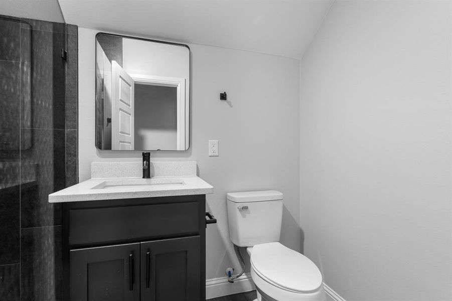 Bathroom with vanity and toilet