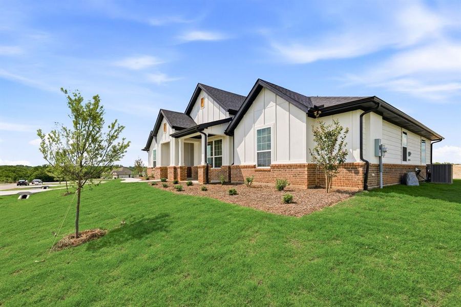 Front exterior of a new home in Saddleback Estates, Boyd, TX, highlighting curb appeal (Image 25). Front exterior of a new home in Saddleback Estates, Boyd, TX, highlighting curb appeal (Image 25).