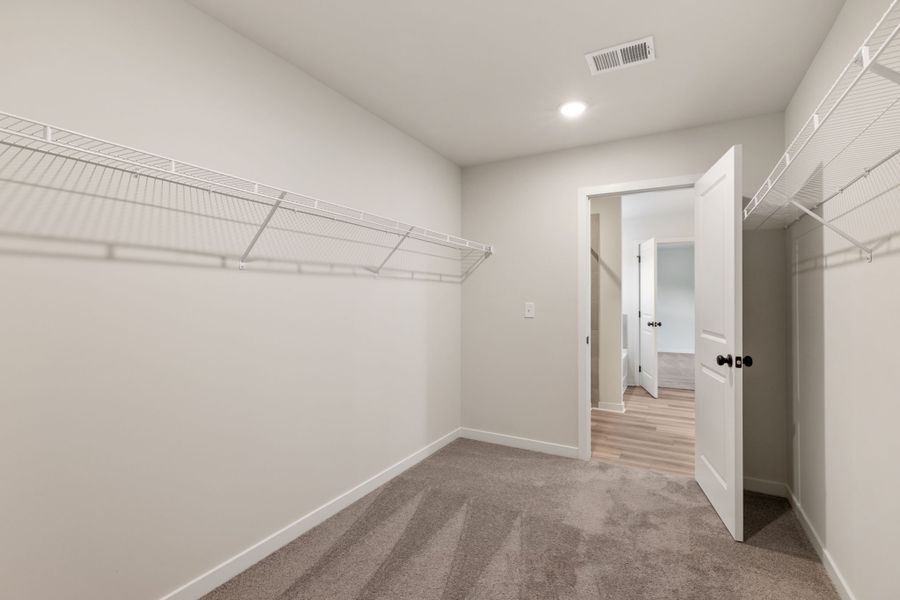 A hallway with white walls.