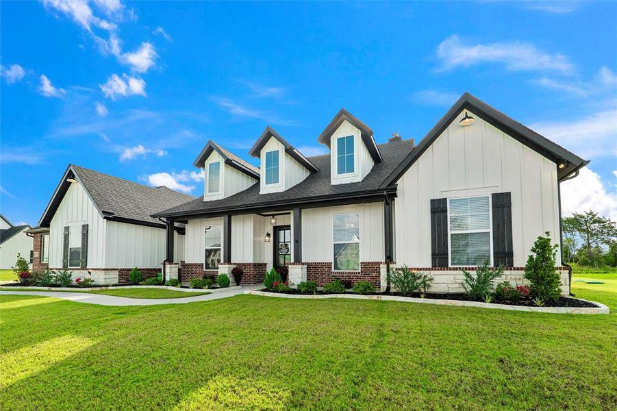 Front exterior of a new home in , Waxahachie, TX, highlighting curb appeal (Image 24). Front exterior of a new home in , Waxahachie, TX, highlighting curb appeal (Image 24).