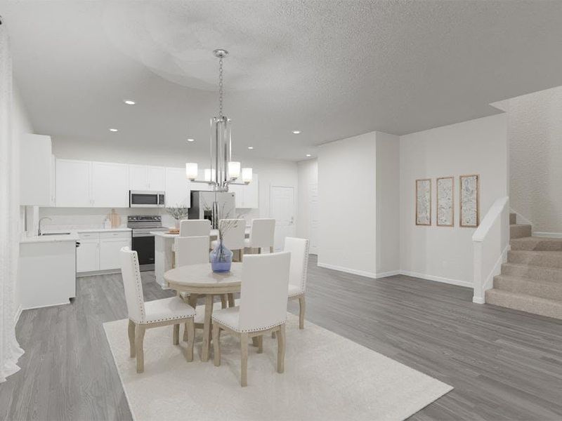 Your bright, open kitchen includes a counter-height island, pantry, and dining space - Maple by Highland Homes