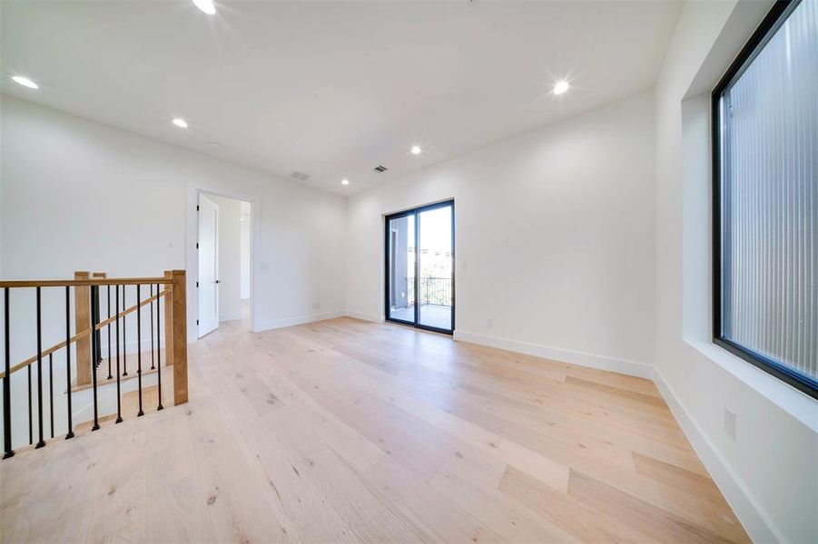 Spare room with light hardwood / wood-style floors