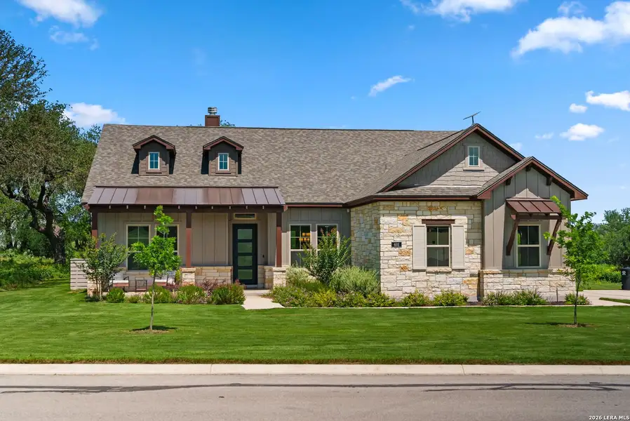 Front exterior of a new home in Legend Park, Castroville, TX, highlighting curb appeal (Image 21).