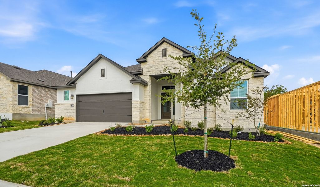 Front exterior of a new home in Esperanza 50's, Boerne, TX, highlighting curb appeal (Image 2). Front exterior of a new home in Esperanza 50's, Boerne, TX, highlighting curb appeal (Image 2).