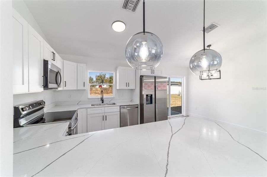 Furnished interior view inside a new home in , Dunnellon (Image 8).