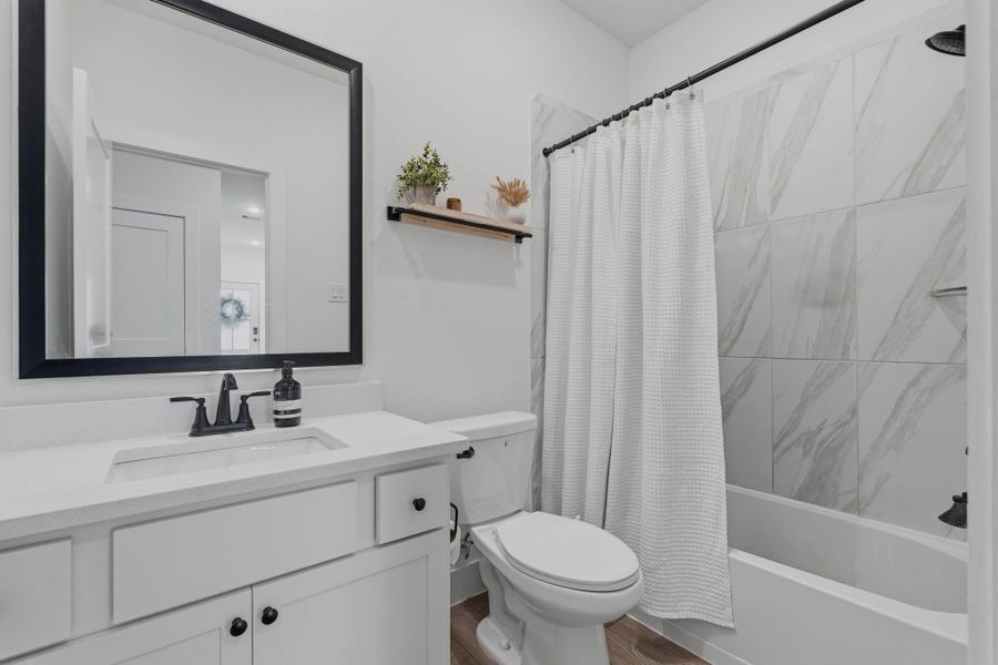 Downstairs bath convenient to the two secondary bedrooms.