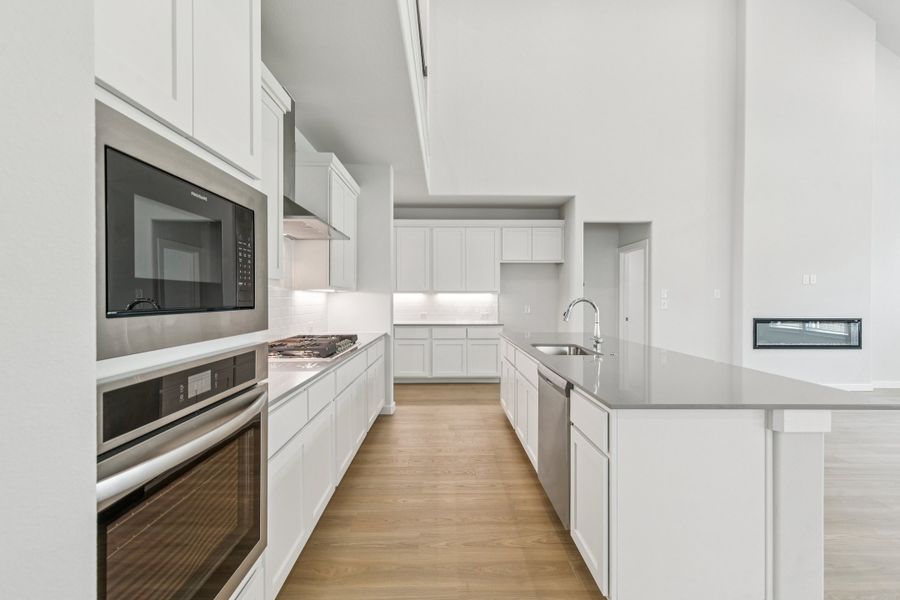 Kitchen in the Mercury home plan by Trophy Signature Homes – REPRESENTATIVE PHOTO Kitchen in the Mercury home plan by Trophy Signature Homes – REPRESENTATIVE PHOTO