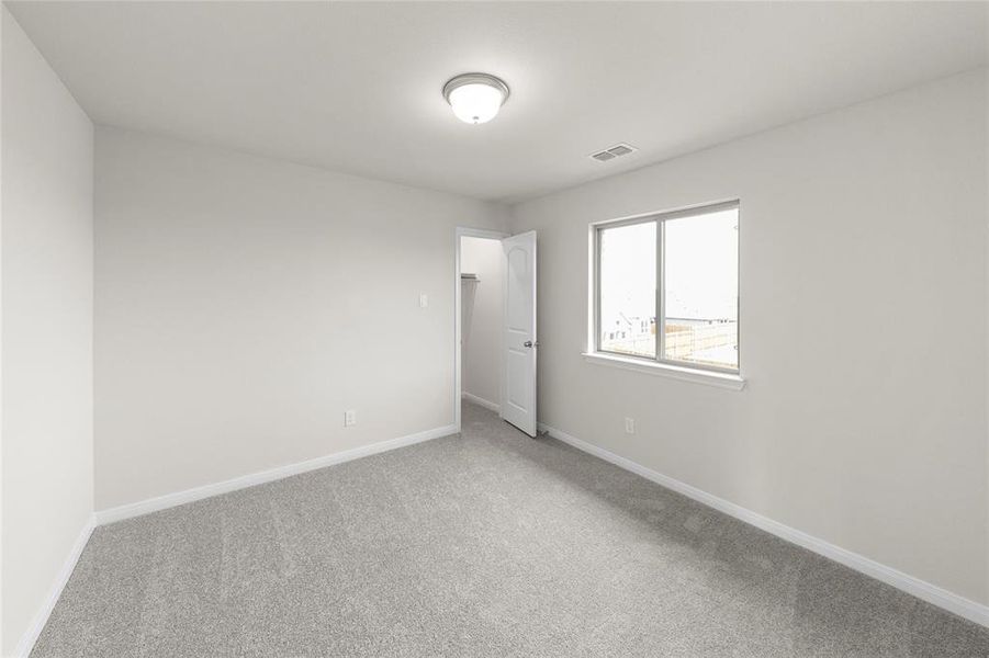 Spare room with carpet flooring