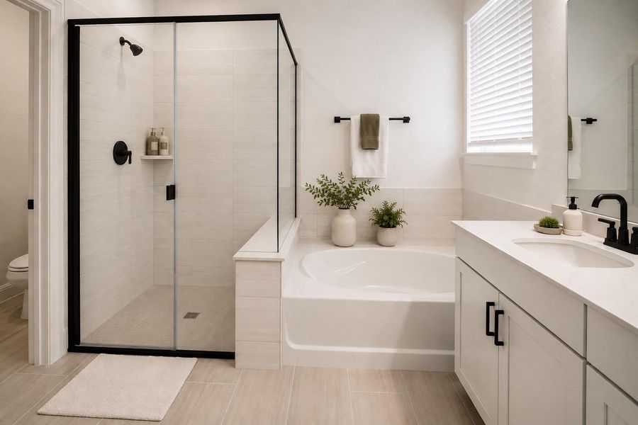 Virtually Staged PhotoA well-appointed bathroom features a glass-enclosed shower, a relaxing soaking tub, and a vanity with modern fixtures.