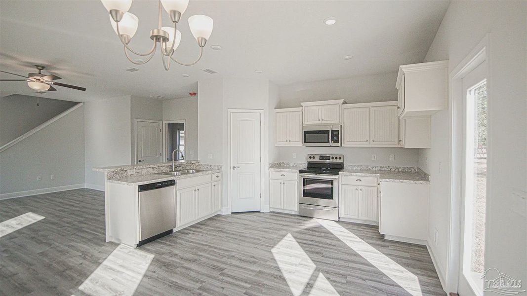 Furnished interior view inside a new home in Pine Top, Cantonment (Image 5).