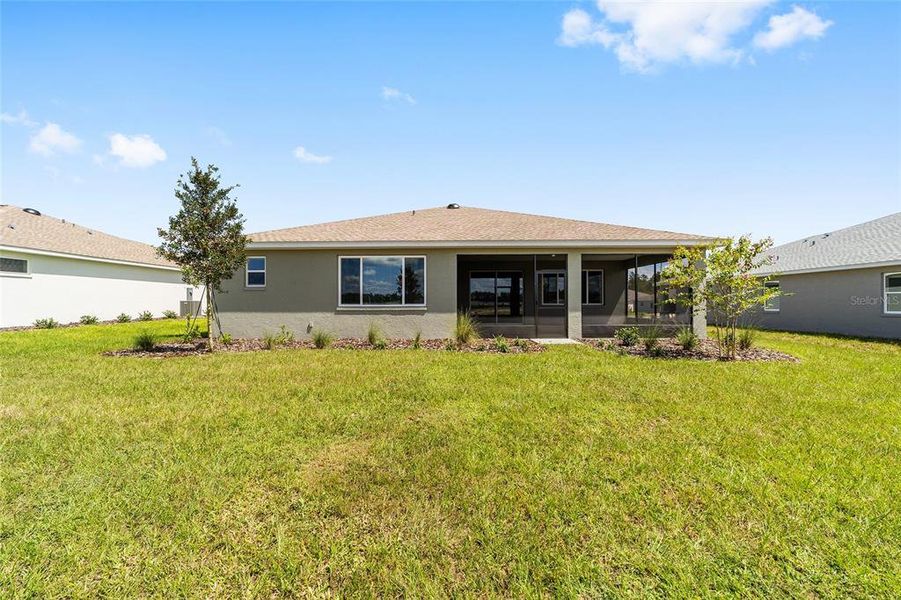 Front exterior of a new home in On Top of the World Communities, Ocala, FL, highlighting curb appeal (Image 23). Front exterior of a new home in On Top of the World Communities, Ocala, FL, highlighting curb appeal (Image 23).