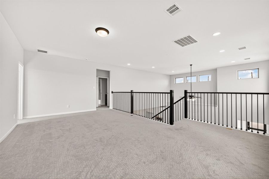 Spacious, unfurnished interior of a new home in Cane Island, Katy (Image 36).