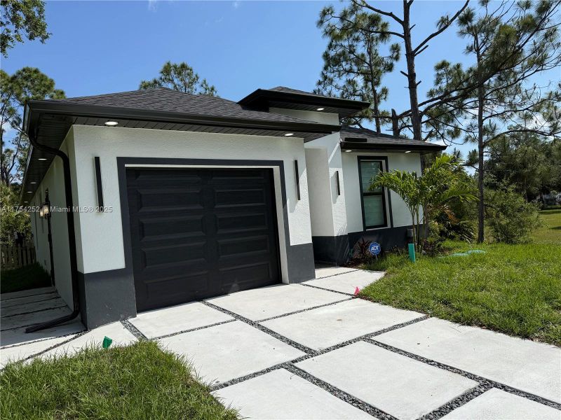 Front exterior of a new home in , Punta Gorda, FL, highlighting curb appeal (Image 23).