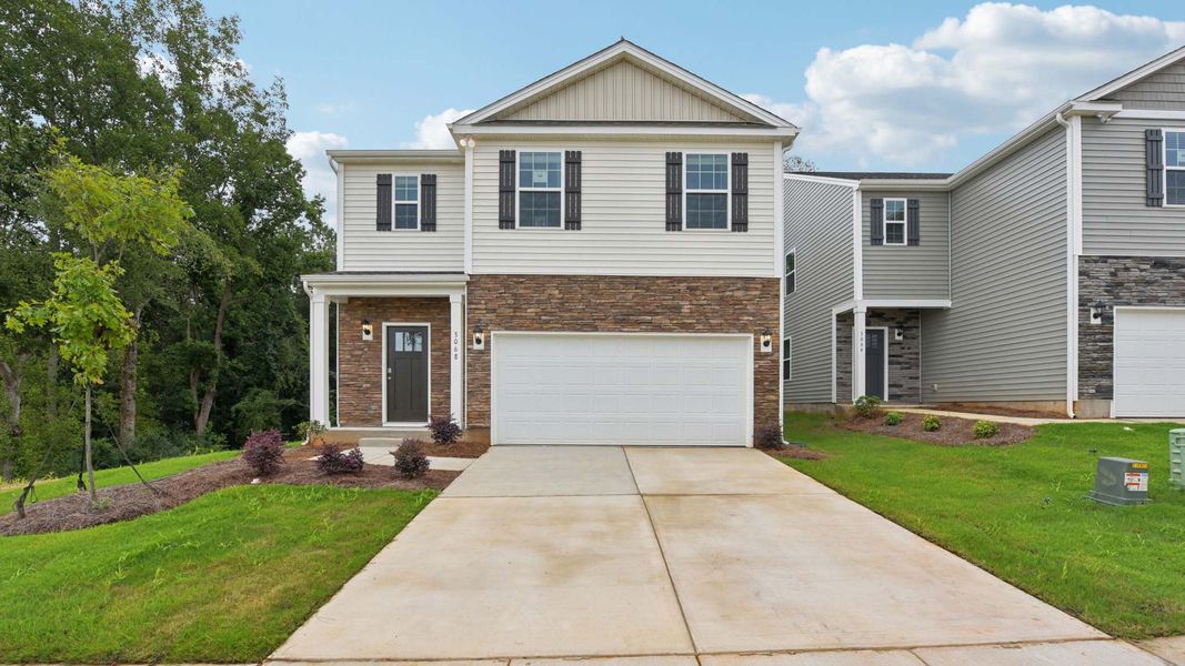 Front exterior of a new home in Secrest Commons, Monroe, NC, highlighting curb appeal (Image 1).