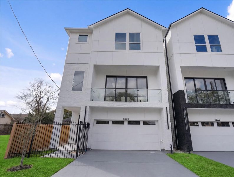 Modern new-construction home with sleek contemporary curb appeal and a two-car garage.Clean architectural lines, large windows, and a gated side entry for added privacy.