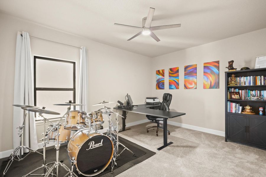 Home office featuring carpet and ceiling fan Home office featuring carpet and ceiling fan