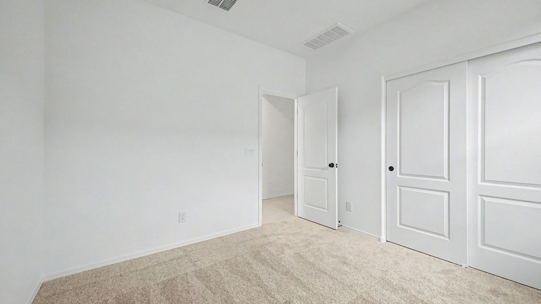 Second bedroom of this move-in ready single-story Clover by DRB Homes at Sienna Park, 1315 S. 215th Drive, Buckeye, AZ 85326. Second bedroom of this move-in ready single-story Clover by DRB Homes at Sienna Park, 1315 S. 215th Drive, Buckeye, AZ 85326.