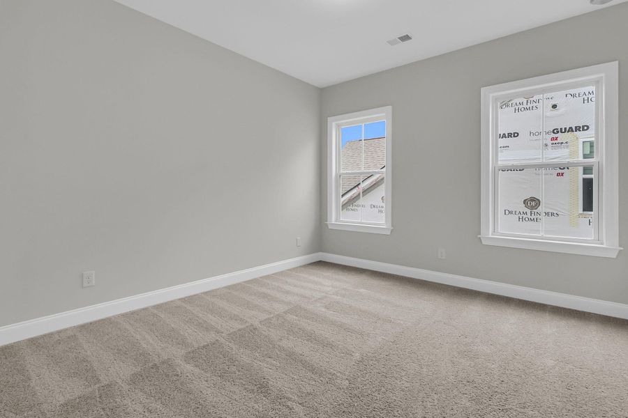 Spacious, unfurnished interior of a new home in Tidewater at Lakes of Cane Bay, Summerville (Image 36).