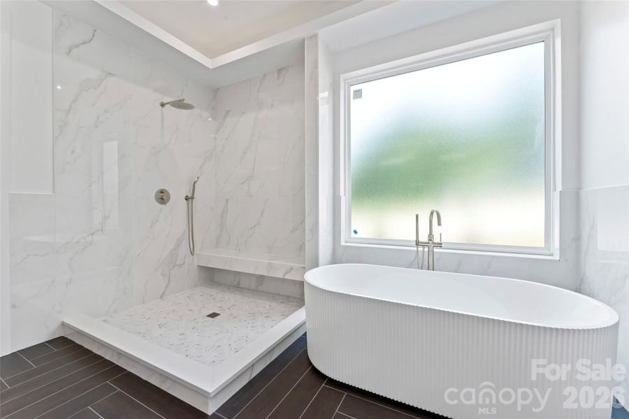 Primary BA -- floor and wall tiled shower. soaking tub, glass doors to be installed