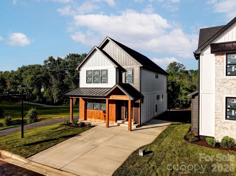 Front exterior of a new home in , Hendersonville, NC, highlighting curb appeal (Image 9). Front exterior of a new home in , Hendersonville, NC, highlighting curb appeal (Image 9).