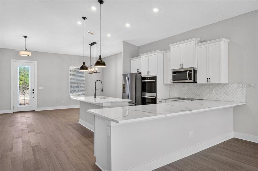 Furnished interior view inside a new home in Stables at Cary Forest, Bryceville (Image 8).