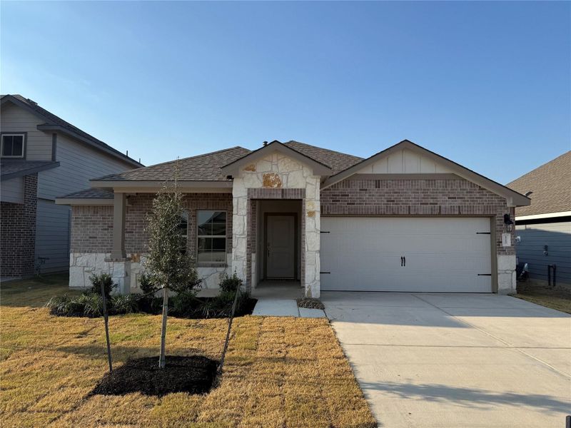 Front exterior of a new home in Southern Pointe, College Station, TX, highlighting curb appeal (Image 1). Front exterior of a new home in Southern Pointe, College Station, TX, highlighting curb appeal (Image 1).