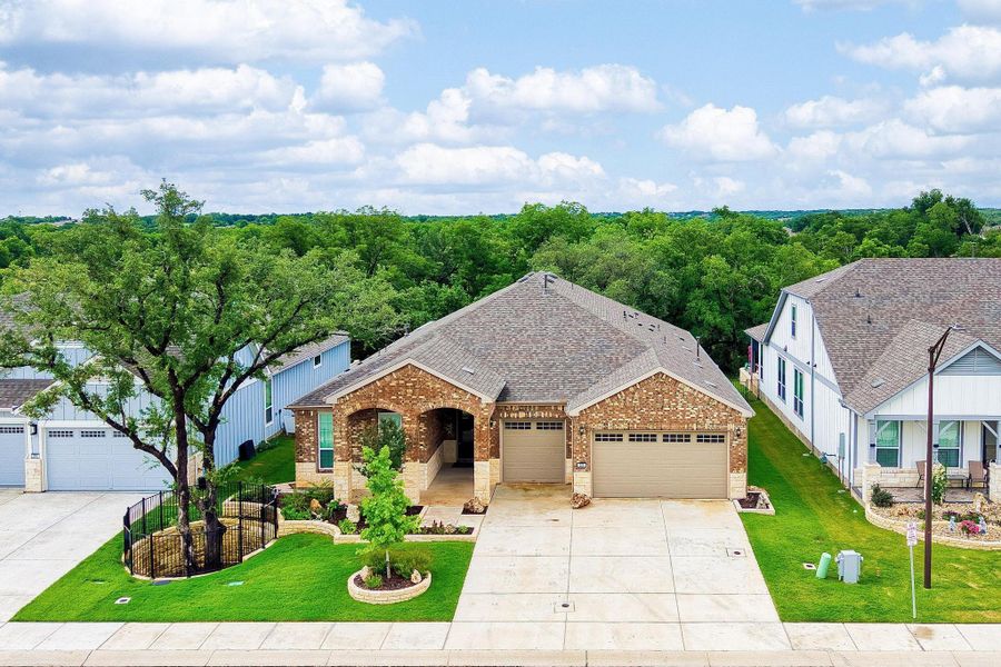 A classic brick exterior with a well-manicured lawn offers a welcoming curb appeal and two garage doors. A classic brick exterior with a well-manicured lawn offers a welcoming curb appeal and two garage doors.
