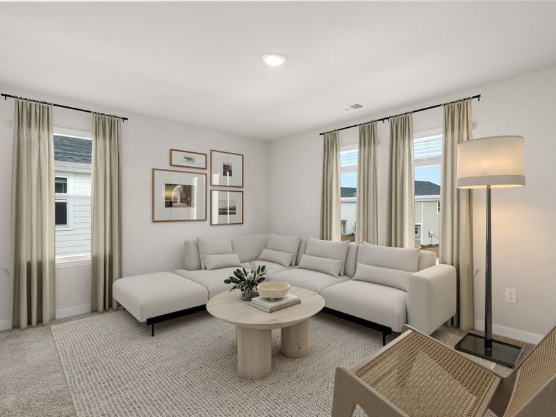 Upstairs, the loft makes the perfect media space or playroom.