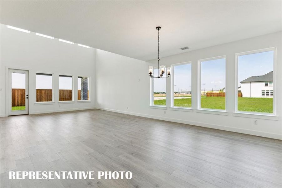 Windows everywhere stream in tons of natural light into this dream home!  REPRESENTATIVE PHOTO