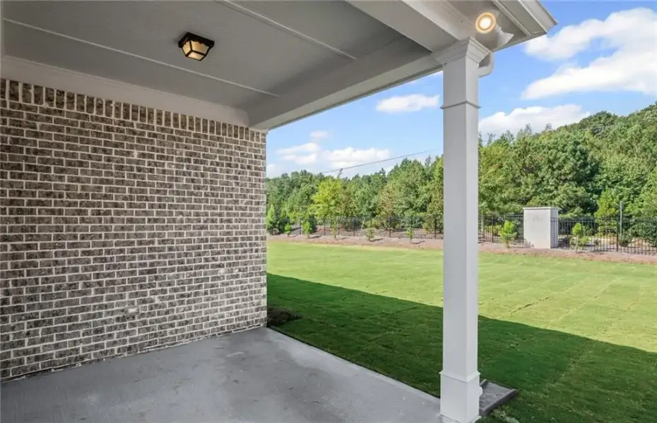 Exterior details and patio area of a home in Overland, Locust Grove (Image 3).