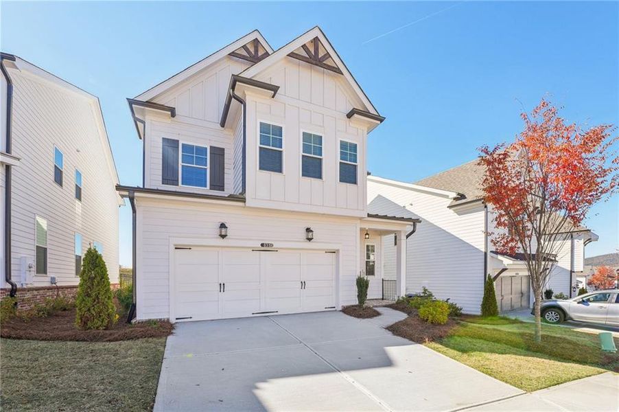 Front exterior of a new home in Palisades Single Family, Cumming, GA, highlighting curb appeal (Image 2).