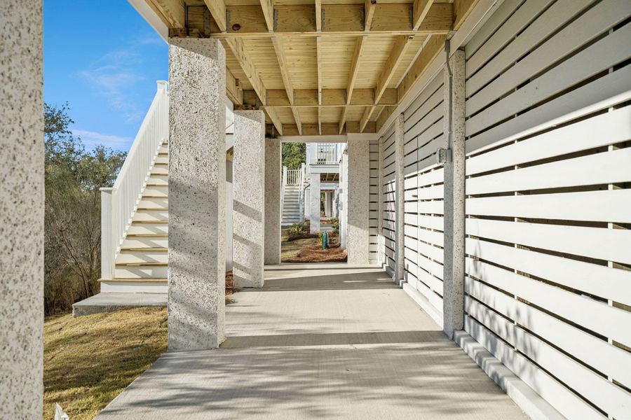 Exterior details and patio area of a home in Overlook at Copahee Sound, Awendaw (Image 37).