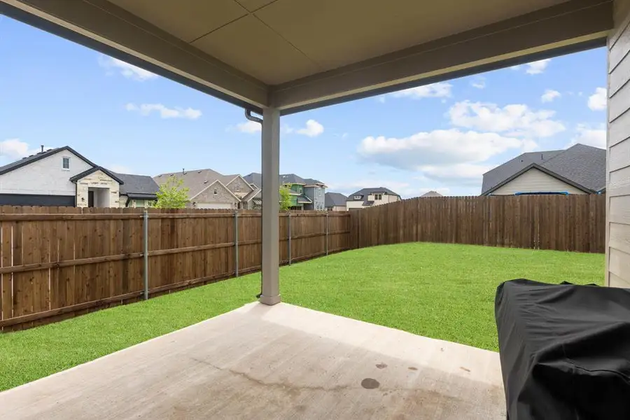 Exterior details and patio area of a home in Elevon, Lavon (Image 3).