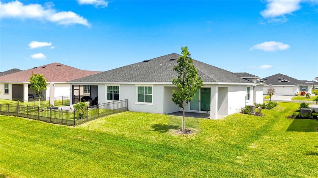 Exterior details and patio area of a home in The Timbers at Everlands, Palm Bay (Image 33).