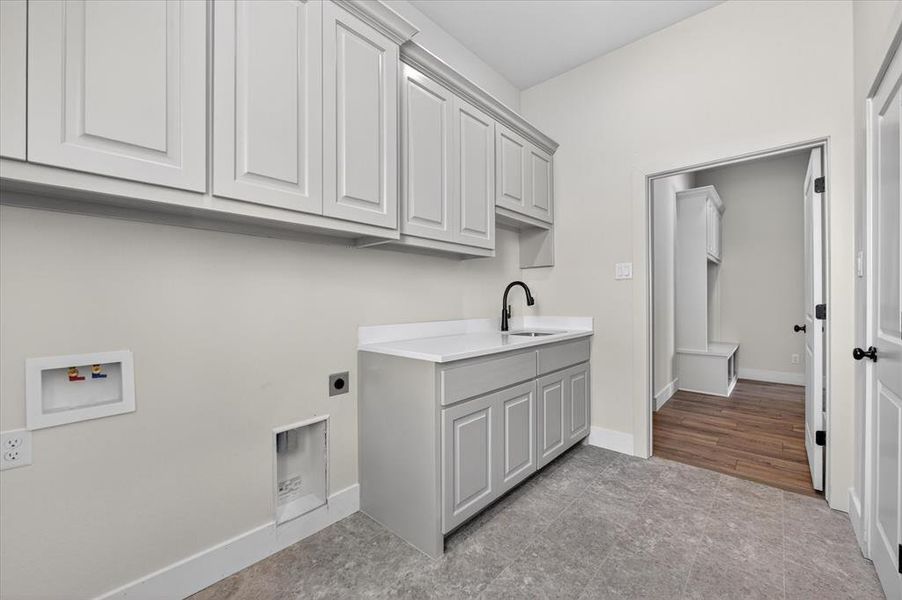 Laundry area featuring cabinet space, electric dryer hookup, and hookup for a washing machine